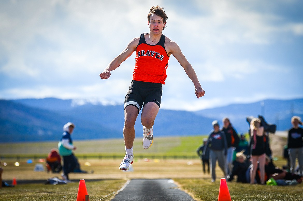 Flathead's Dylan Zink competes in the triple jump during a crosstown track and field meet at Glacier High School on Tuesday, April 19. (Casey Kreider/Daily Inter Lake)