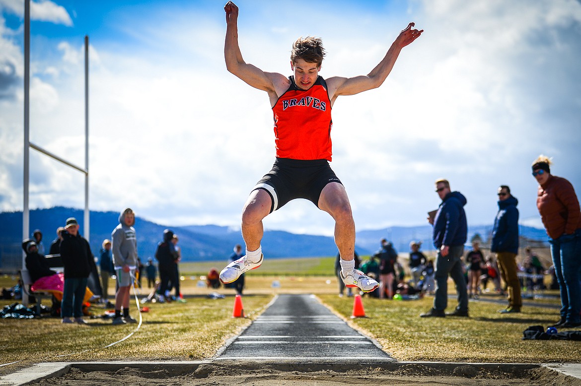 Flathead's Dylan Zink competes in the triple jump during a crosstown track and field meet at Glacier High School on Tuesday, April 19. (Casey Kreider/Daily Inter Lake)