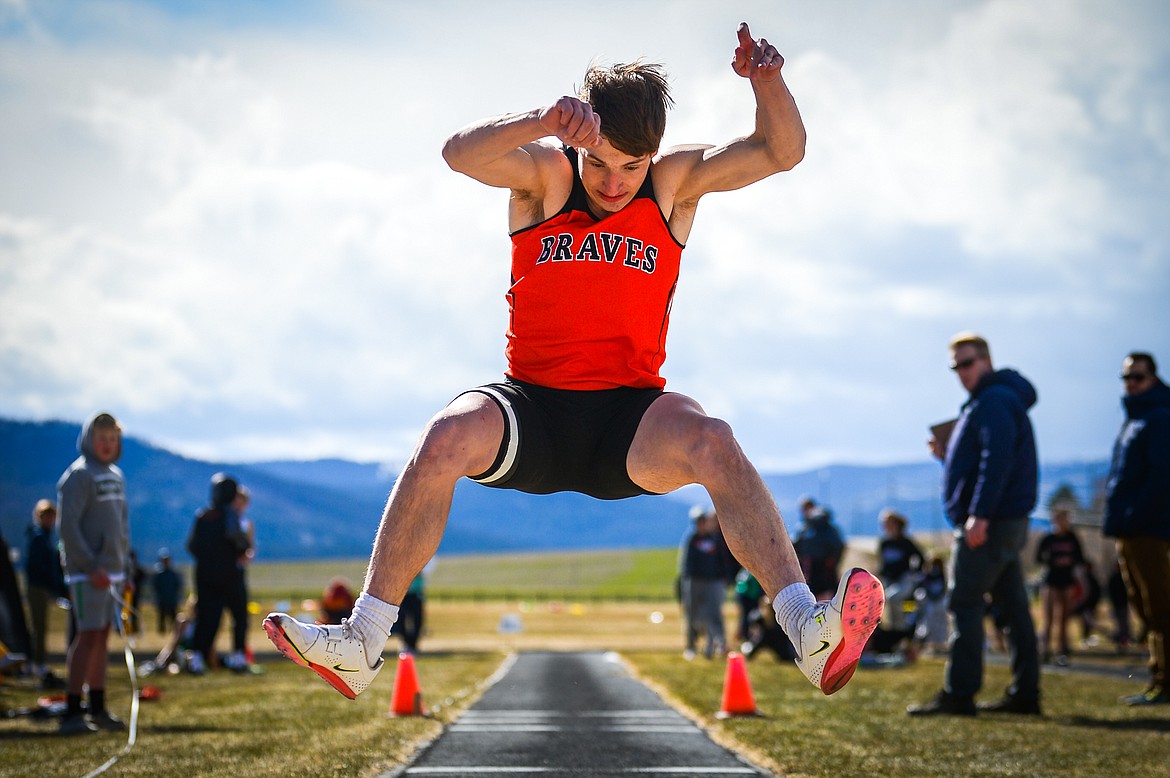 Flathead's Dylan Zink competes in the triple jump during a crosstown track and field meet at Glacier High School on Tuesday, April 19. (Casey Kreider/Daily Inter Lake)