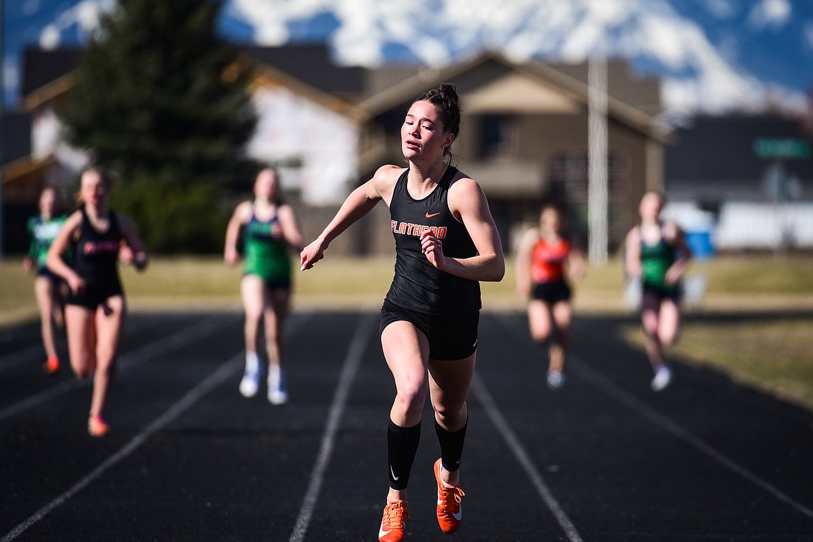 Flathead's Peyton Walker crosses the finish line in the girls 400 meter dash during a crosstown track and field meet at Glacier High School on Tuesday, April 19. (Casey Kreider/Daily Inter Lake)