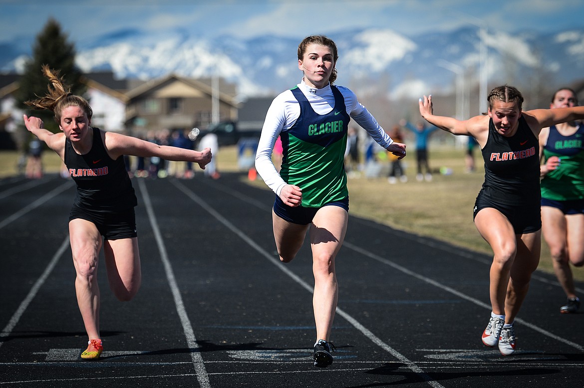 Glacier's Noah Fincher crosses the finish line in the girls 100 meter dash during a crosstown track and field meet at Glacier High School on Tuesday, April 19. (Casey Kreider/Daily Inter Lake)