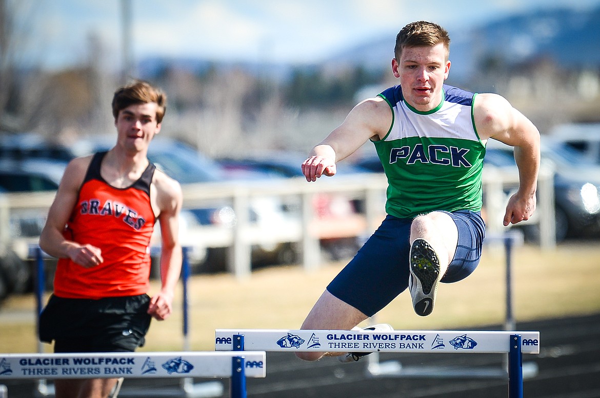 Glacier's Caleb Bernhardt clears a hurdle in the boys 300 meter hurdles during a crosstown track and field meet at Glacier High School on Tuesday, April 19. (Casey Kreider/Daily Inter Lake)