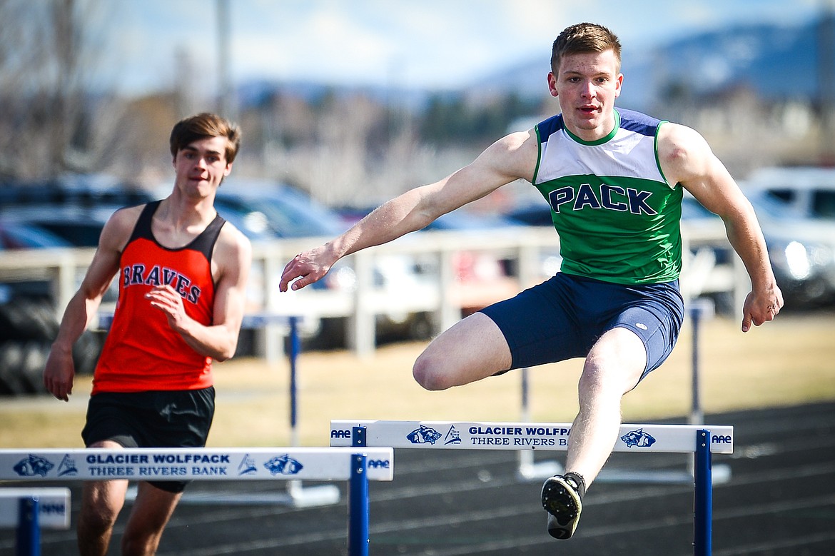 Glacier's Caleb Bernhardt clears a hurdle in the boys 300 meter hurdles during a crosstown track and field meet at Glacier High School on Tuesday, April 19. (Casey Kreider/Daily Inter Lake)