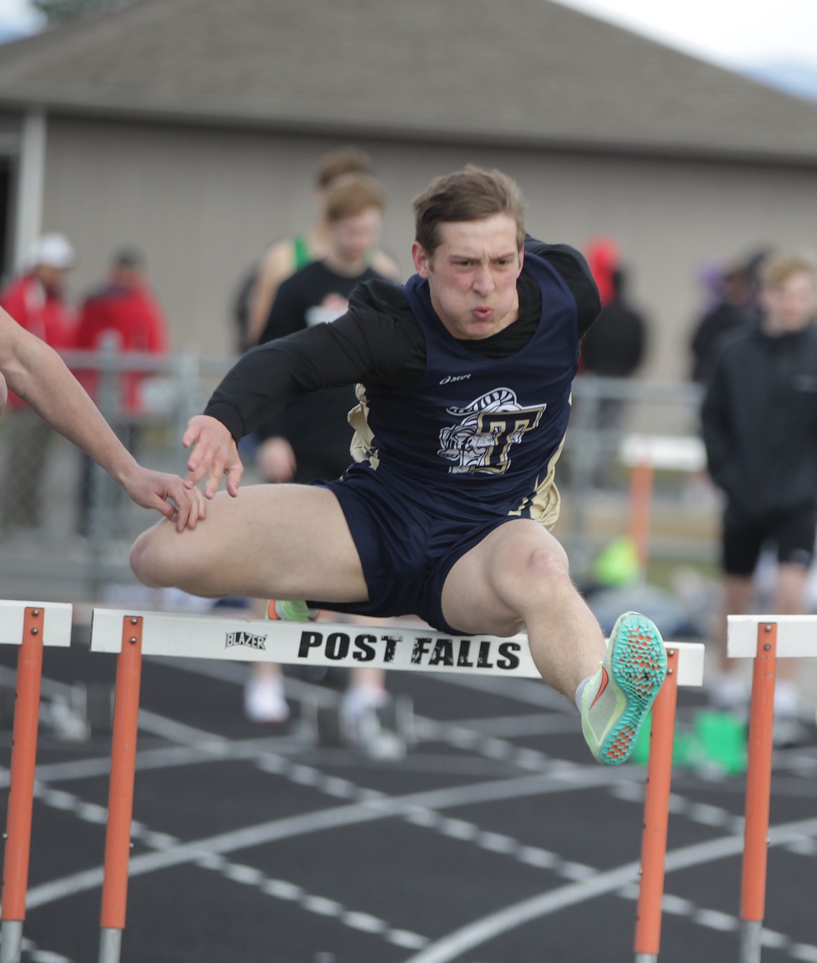 JASON ELLIOTT/Press
Timberlake sophomore Caius Tebbe clears a hurdle during the 110-meter hurdle race at the Christina Finney Relays meet at Post Falls High on Tuesday. Tebbe was the top local finisher in the event, taking third in 16.34 seconds.