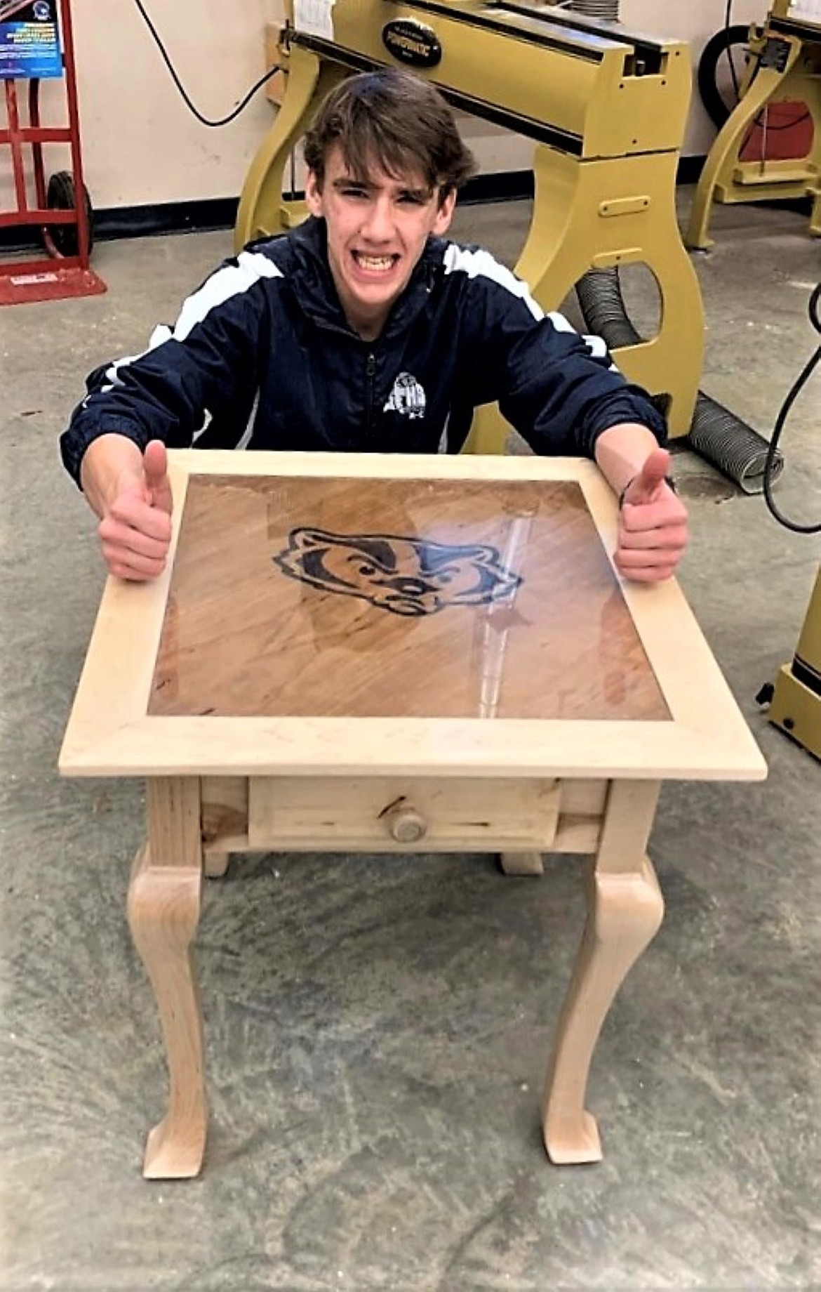 Connor Alexander, the spirited Badger that he is, inlaid a Badger head to reflect his school pride on the top of his table.