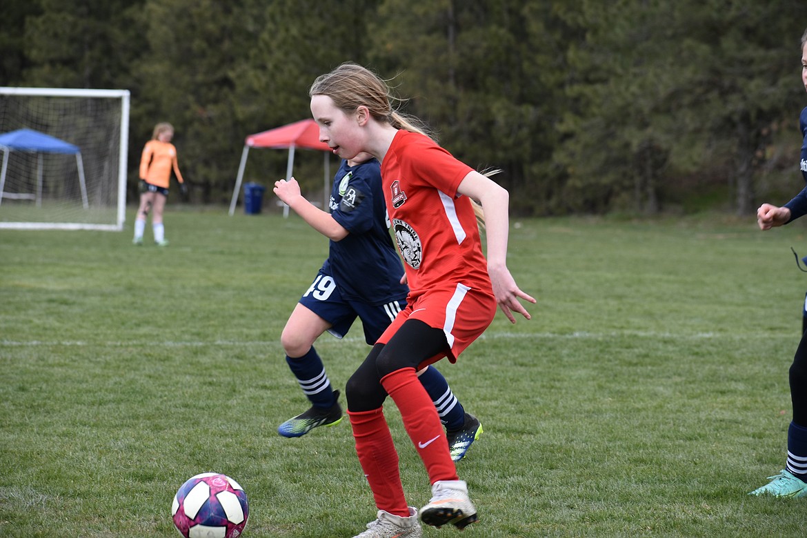 Photo by KARI HYNES
The Thorns 2011 Green girls soccer team wrapped up week 2 of the spring season with a loss to FC Spokane G2012 and the Spokane Sounders G2011. Zoe Lemmon (pictured) scored the Thorns' only goal against FC Spokane G2012 on an assist from Payton Brennan. In the Thorns' second game of the weekend against the Spokane Sounders G2011, Payton Brennan had the team's two goals, one assisted by Ava Langer. The girls travel to Boise this weekend for the Performance Cup.