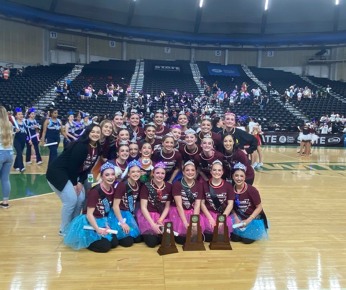 The Moses Lake High School Molahiettes display two state championship and one second-place trophy following the state championships in late March. The dancers and their coach said they had some stresses getting back on the state-level dance floor, but practice and community support paid off.