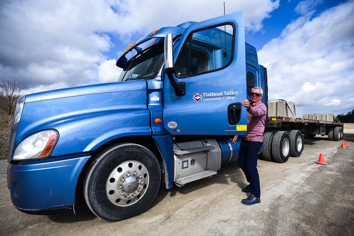 Former Flathead Valley Community College CDL student Bernard Jourdain steps into one of the college's 18-wheelers on Wednesday, April 20. (Casey Kreider/Daily Inter Lake)