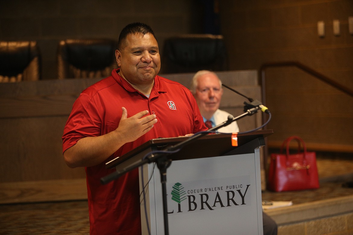 Coeur d'Alene Tribe Chairman Chief Allan thanks the Kootenai County Task Force on Human Relations for a $10,000 grant received Tuesday in the Library Community Room. Task Force Secretary Tony Stewart looks on.