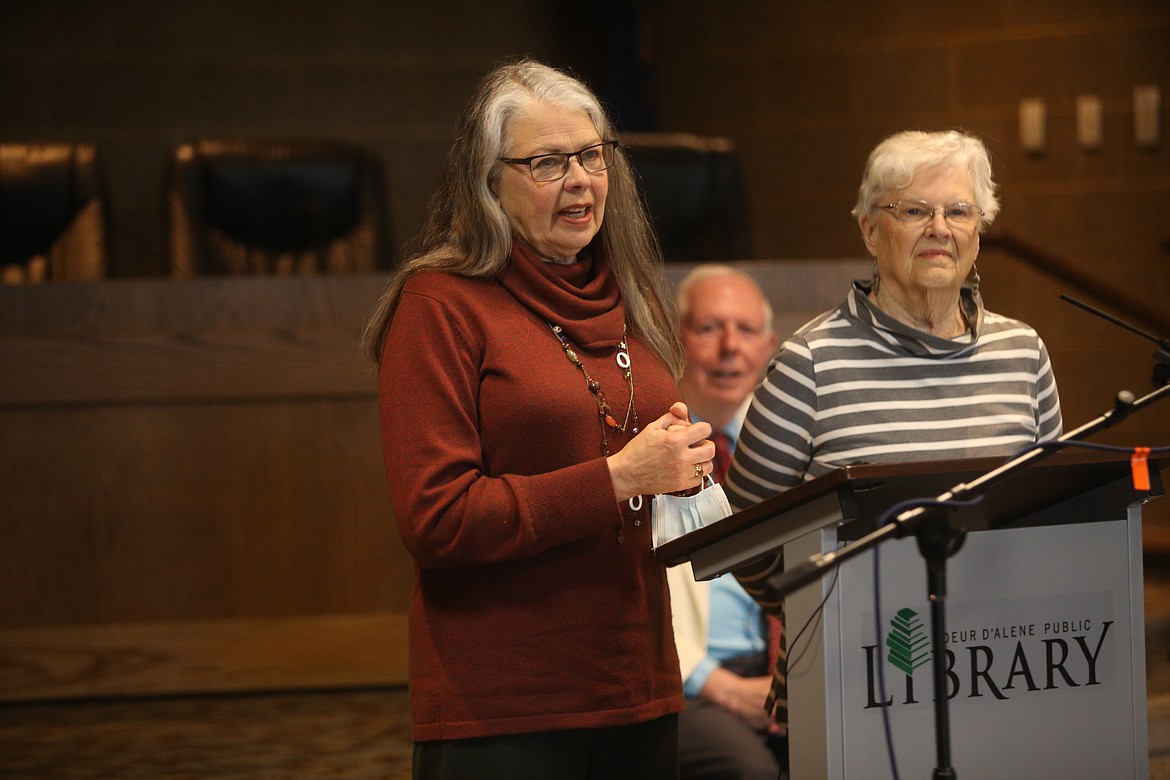 Linda Navarre, co-president of the Bonner County Human Rights Task Force, and board member Sharon McCahon accept a $4,000 grant on Tuesday, while Tony Stewart, secretary with the Kootenai County Task Force on Human Relations, looks on.