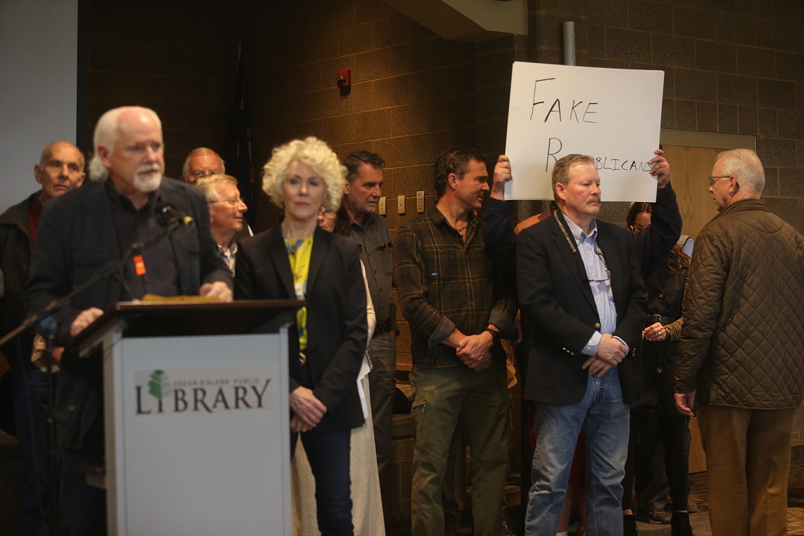 A man holding a sign disrupted the Wednesday news conference where local Republicans announced the formation of North Idaho Republicans, a new group. KAYE THORNBRUGH/Press