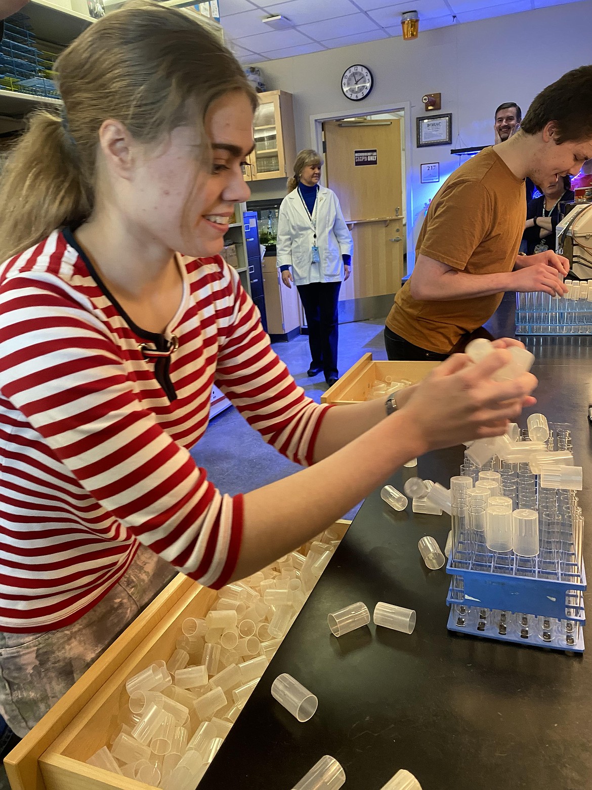 North Idaho College students Aurora Reishus and William Auten compete in the
2022 Cap Off competition to see who will cap 72 test tubes first. Auten was declared the winner with a time of 1 minute 13 seconds.