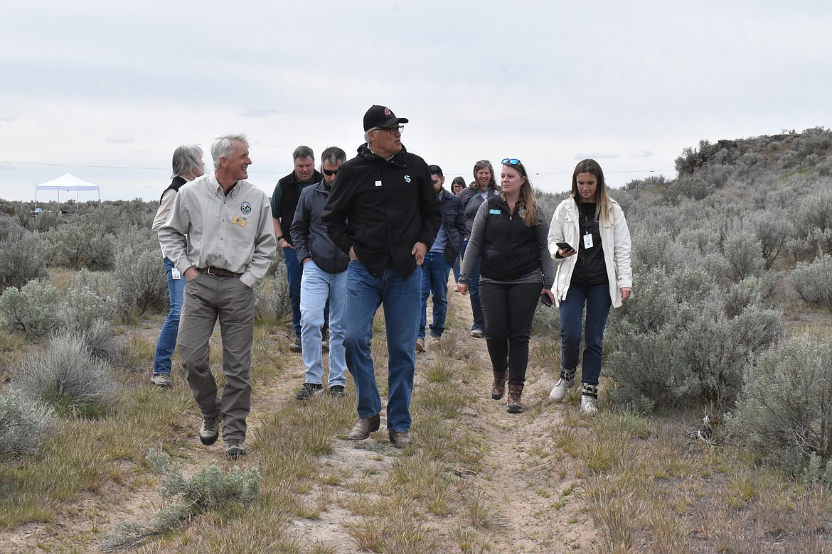 Washington Governor Jay Inslee talks to members of Washington Department of Fish and Wildlife at the Black Rock Coulee area on April 20 near Moses Lake. Inslee visited the region on Wednesday to promote multiple environmental programs.