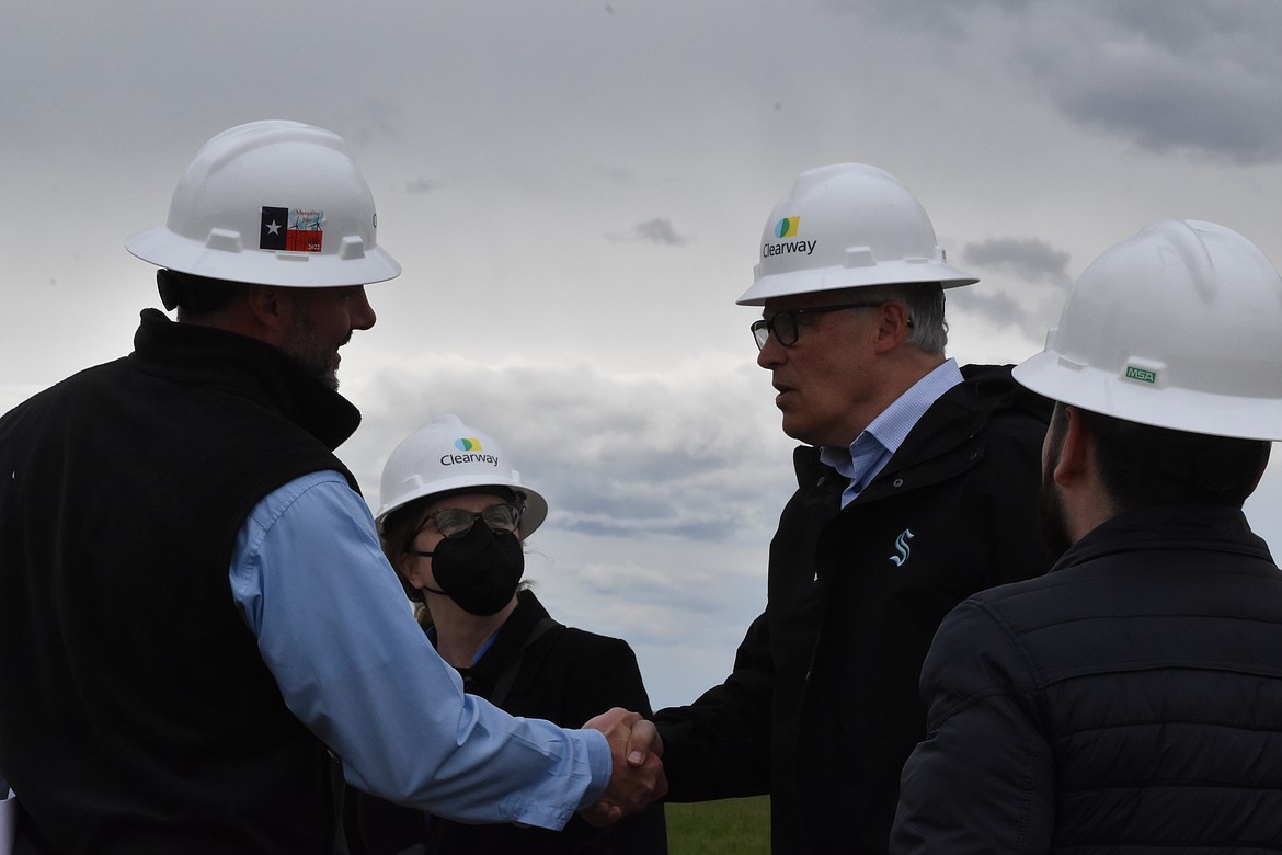 Governor Jay Inslee shakes hands with Ben Fairbanks, Managing Director of U.S. wind development for Clearway, at the Rattlesnake Wind Farm opening celebration on April 20 in Ritzville.