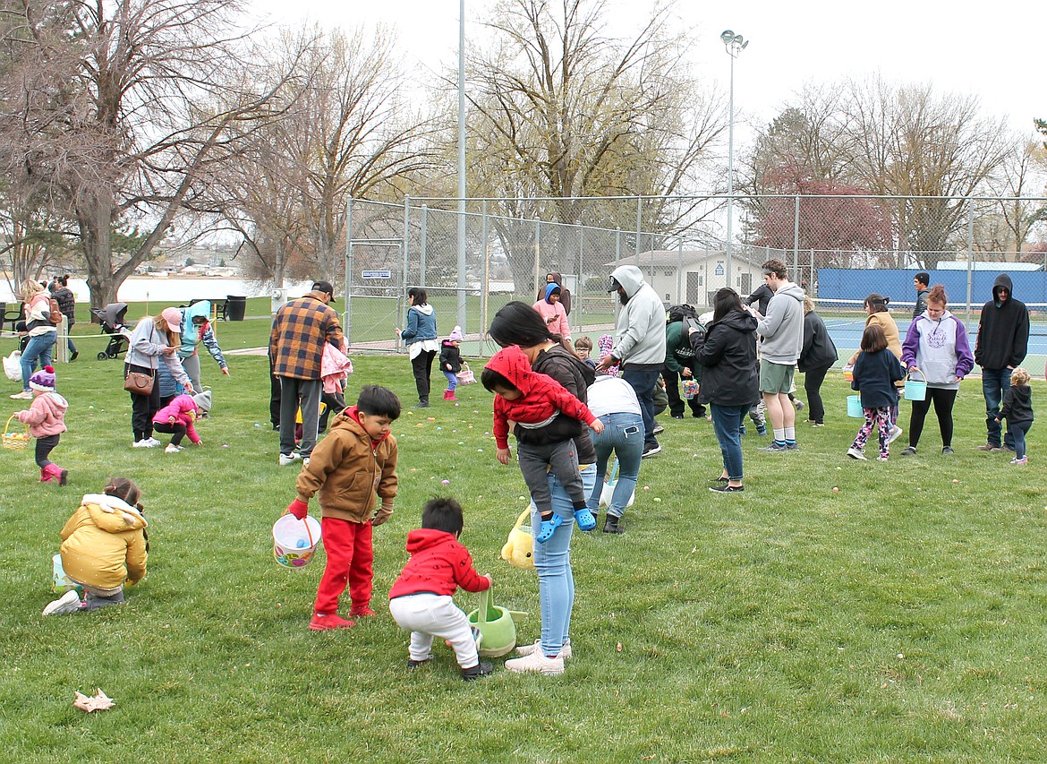 Children descend on McCosh Park Saturday for the annual Easter egg hunt sponsored by the Moses Lake Lions Club. The hunt started at noon and all the eggs had been snapped up by 12:04.