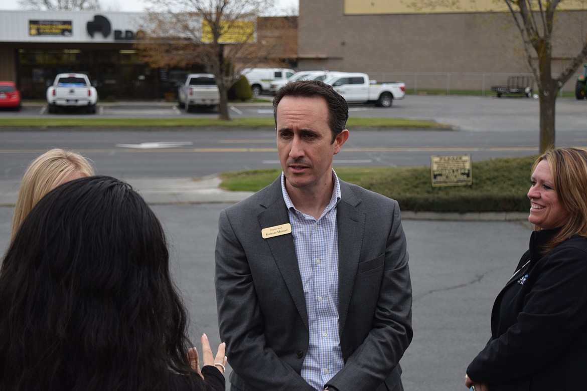 Kamyar Monsef, senior vice president and chief of retail banking for Peoples Bank, at the ribbon-cutting Monday for the bank’s new loan center in Moses Lake. Monsef encourages car buyers get pre-approved for financing first before going out to buy a car. He said this allows car shoppers to compare their needs with their budgets.