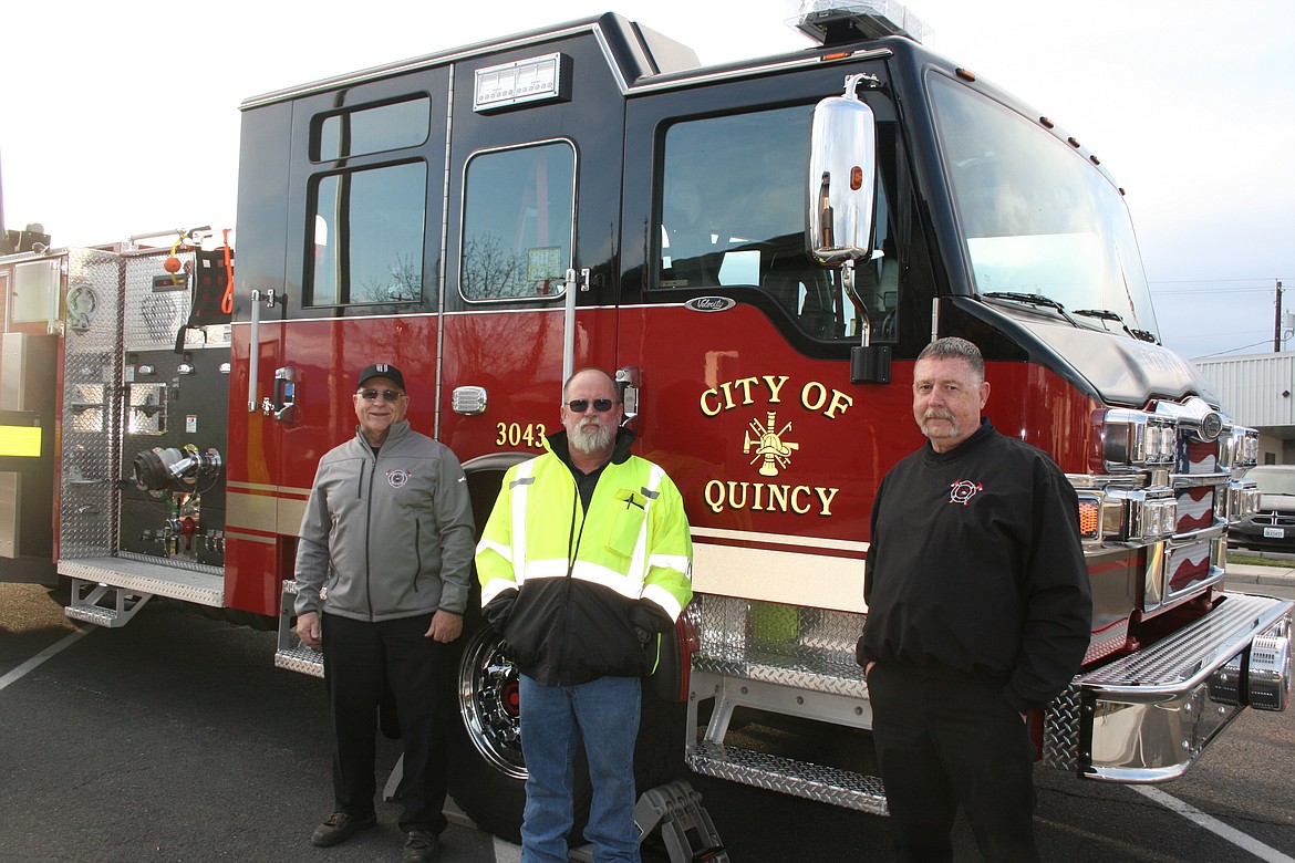 (From left) Jim Kling, assistant chief for Grant County Fire District 3, Howard Van Baugh, Quincy Public Works maintenance supervisor and GCFD 3 volunteer, and Jim Stucky, mechanic for GCFD 3, made up the apparatus committee that worked out the specs for the city of Quincy’s new fire truck, delivered Tuesday.