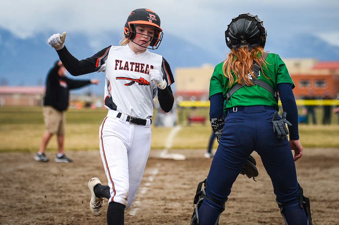 Flathead's Brynn Mailman (3) scores a run on a two-run single by Kaidyn Lake (5) against Glacier at Glacier High School on Thursday, April 21. (Casey Kreider/Daily Inter Lake)