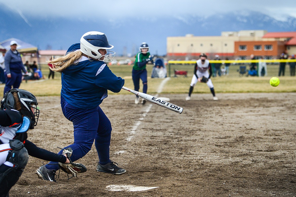 Glacier's Paishance Haller (27) connects on a two-run single in the first inning against Flathead at Glacier High School on Thursday, April 21. (Casey Kreider/Daily Inter Lake)