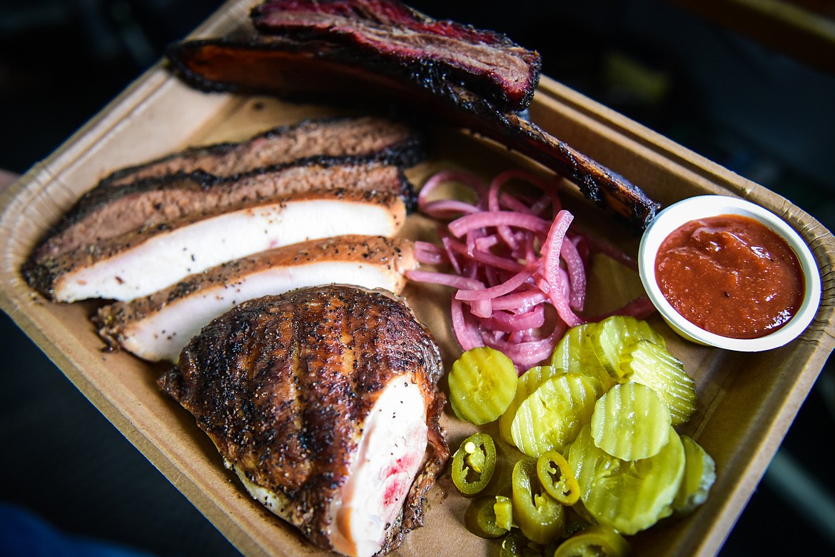 A tray consisting of a beef short rib, brisket, smoked turkey, smoked chicken, jalapenos, pickles, pickled onions and barbeque sauce from the Arn's BBQ food truck in Kalispell on Wednesday, April 20. (Casey Kreider/Daily Inter Lake)