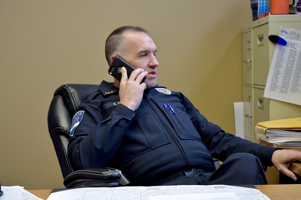 Moses Lake Police Chief Kevin Fuhr in his office on Wednesday taking a call from the Moses Lake Regional Tactical Response Team, which was responding to a report of a wanted felon in a house not far from George.