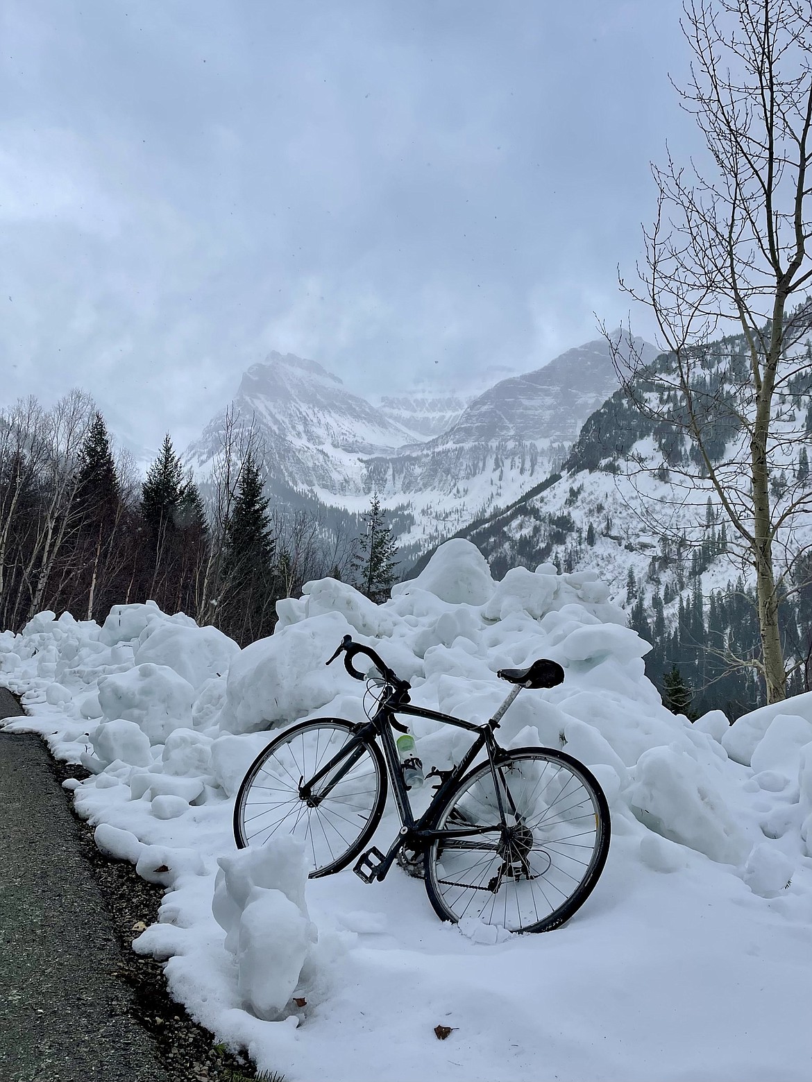 A bike rests on a snow pile at the loop on Going-to-the-Sun Road in Glacier National Park. (JP Edge/Hungry Horse News)