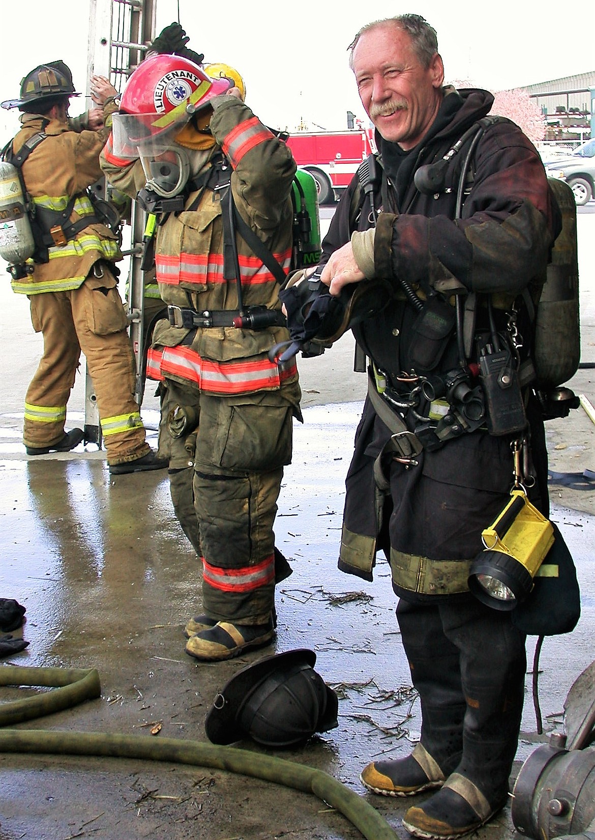 Late Fire Chief Jeff Welch, right, is all smiles in a dirty turnout jacket during a training day in Spokane Valley. The JW Memorial Foundation has been created to honor his wish to help the families of fallen and severely injured first responders. The kickoff event is April 30.
