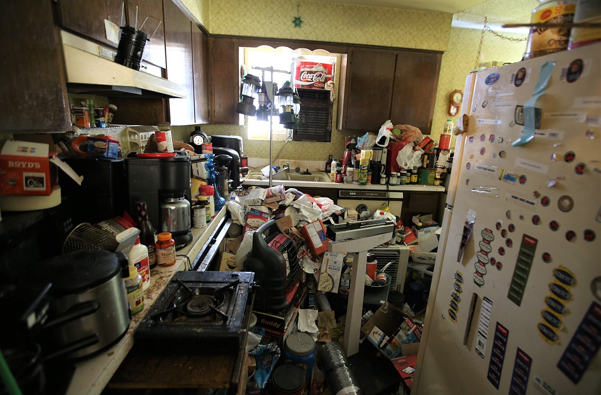 Extreme hoarding in a Coeur d'Alene home, left very little space in the kitchen for the former occupant to move around.