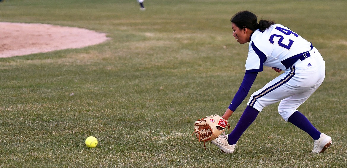 Turquoise Pierre scoops up a single to right field against Columbia Falls. (Scot Heisel/Lake County Leader)