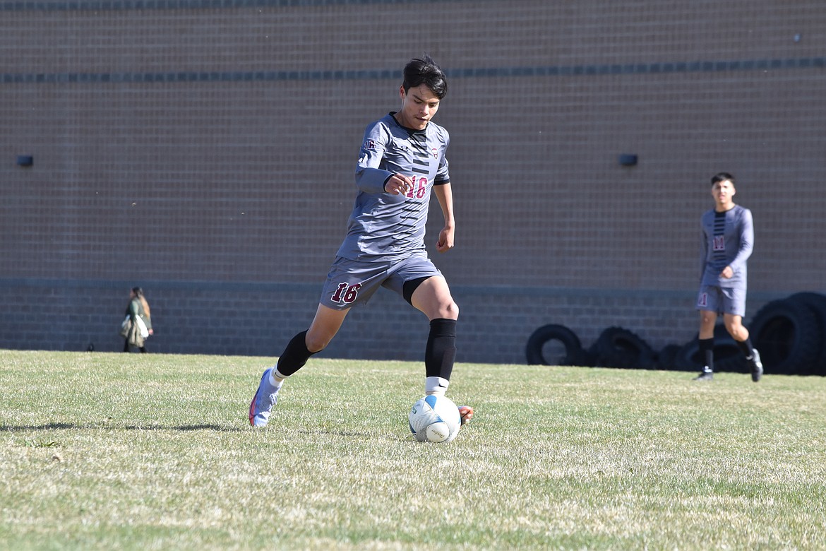 Wahluke High School junior Daniel Ferral (16) drives the ball down field during the matchup against La Salle on April 21.