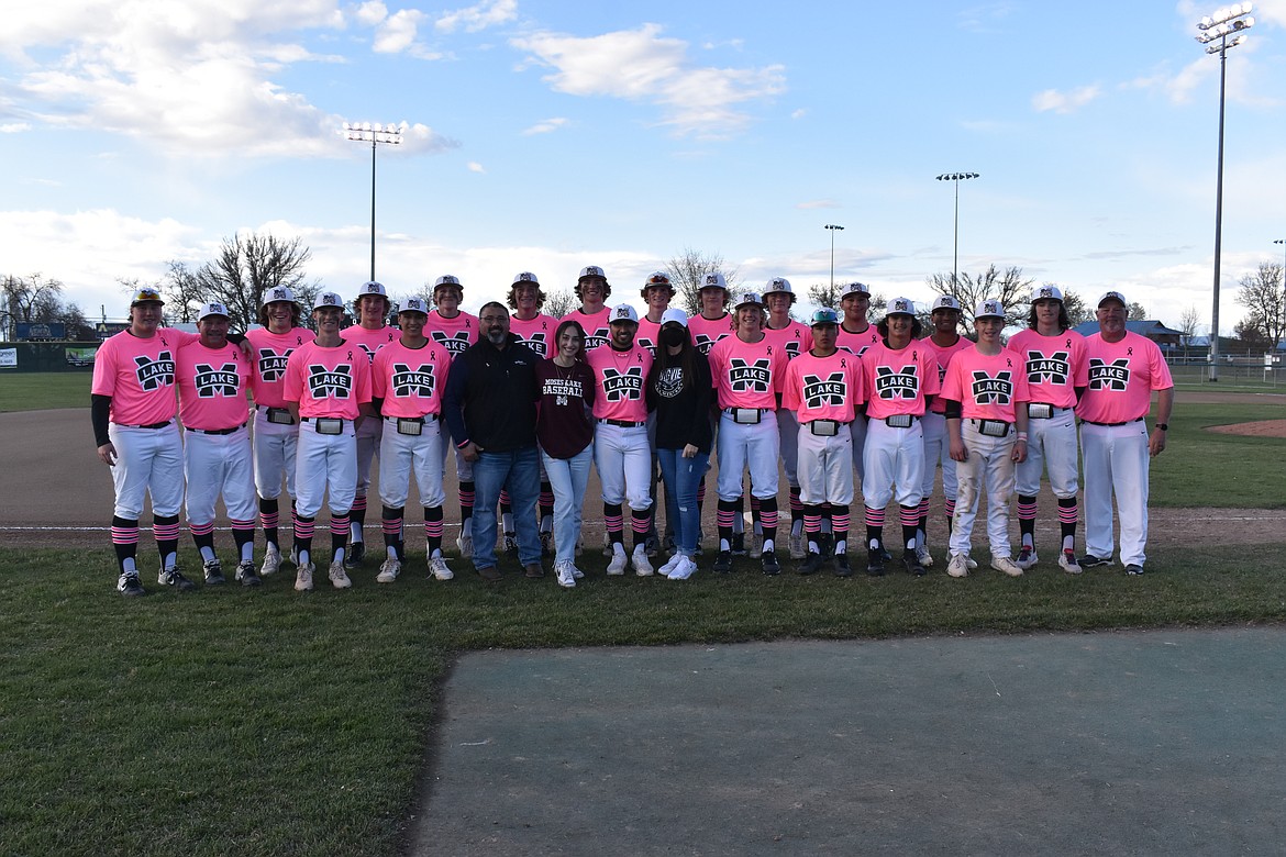 The Moses Lake High School baseball team poses with the Vela family shortly after the first game of the double header against Wenatchee High School on April 22. The Vela family from left to right in the front row: father Jaime Sr., daughter Emma, son Jaime Jr. and mother Maribel. Son Miguel Vela was not able to attend.