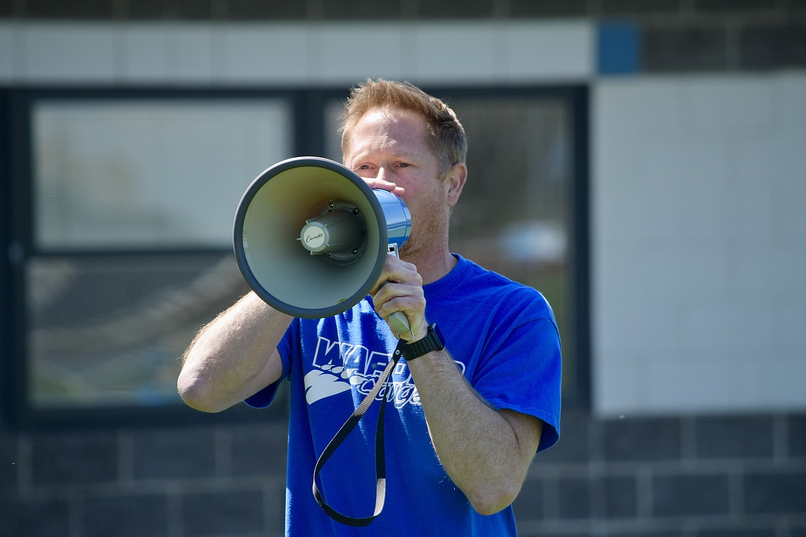 Warden Elementary School Principal Curtis Weber gives out instructions to elementary school students ahead of the district’s annual elementary school jog-a-thon fundraiser on Friday.