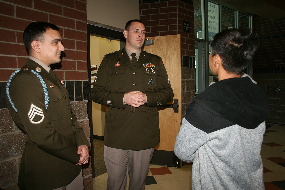 SSG Alvin Toro (left) and Sgt. Joshua Britcher (right) talked about opportunities offered by the U.S. Army with Wahluke High School and Wahluke Junior High students during the school’s Outdoor Career Fair.