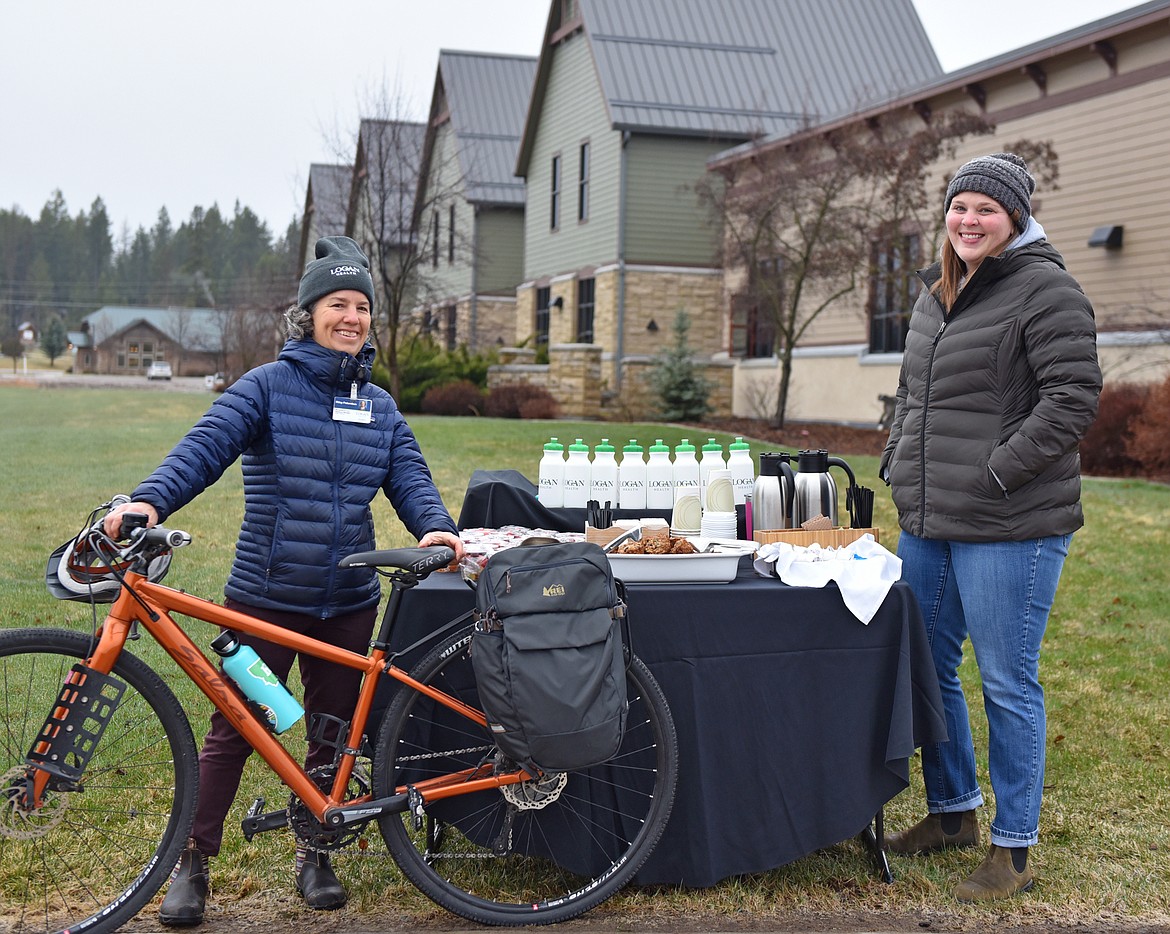 Riley Polumbus and Liz Records at the 'bike or walk to work' table at Logan Health on Earth Day. (Julie Engler/Whitefish Pilot)