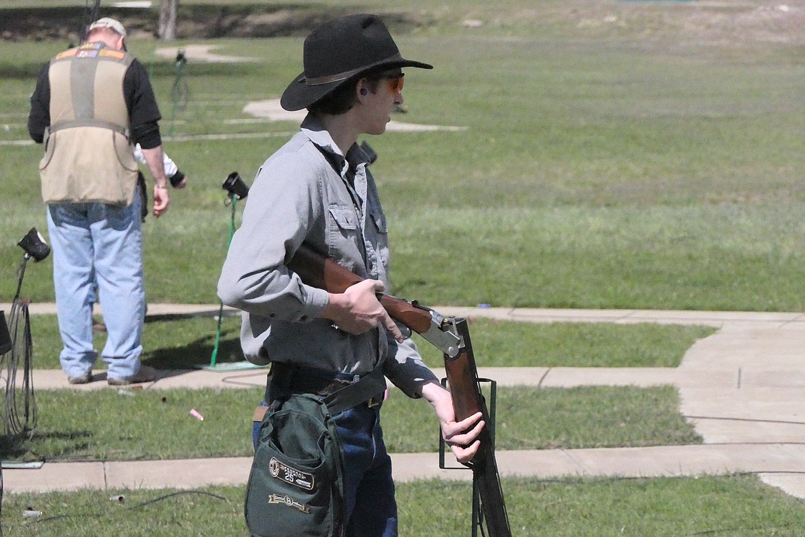 Sandpoint, Idaho resident Edward Feldkamp pauses to reload his double-barrel shotgun during Saturday's 24th running of the Plains Trap Club Turkey Shoot.  (Chuck Bandel/VP-MI)