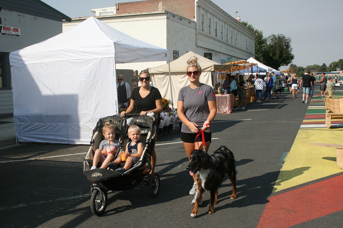 Shoppers walk Quincy’s B Street during the Quincy Farmers Market in September 2021. The Quincy City Council will hold a public hearing May 3 on a proposal for a traffic revision to one block of B Street.