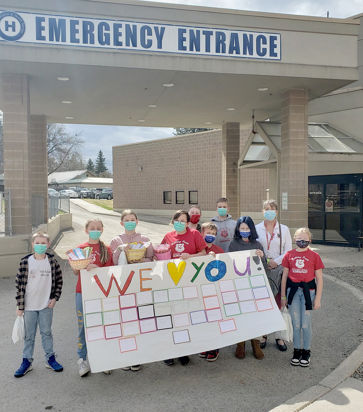 Idaho Hill Elementary Student Council representatives pose for a photo outside Newport Hospital and Health Services' emergency department before thanking staff for the healthcare workers' dedication during the COVID-19 pandemic.