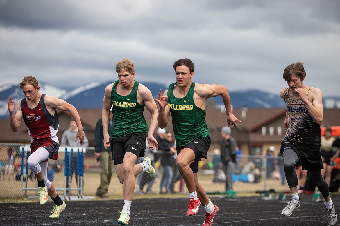 Bulldog sprinters Scott Dalen and Ryder Barinowski compete in the 100 meter race in Columbia Falls on Saturday. (JP Edge photo)