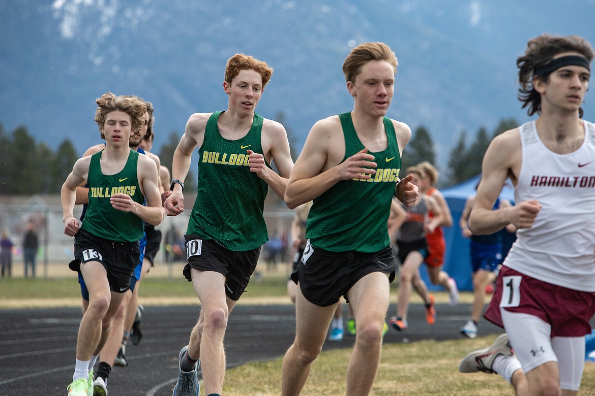 Bulldogs, from left to right, Ethan Amick, Nate Ingelfinger and Jacob Henson run in the 1600 meter event at the Iceberg Invite on Saturday. (JP Edge photo)