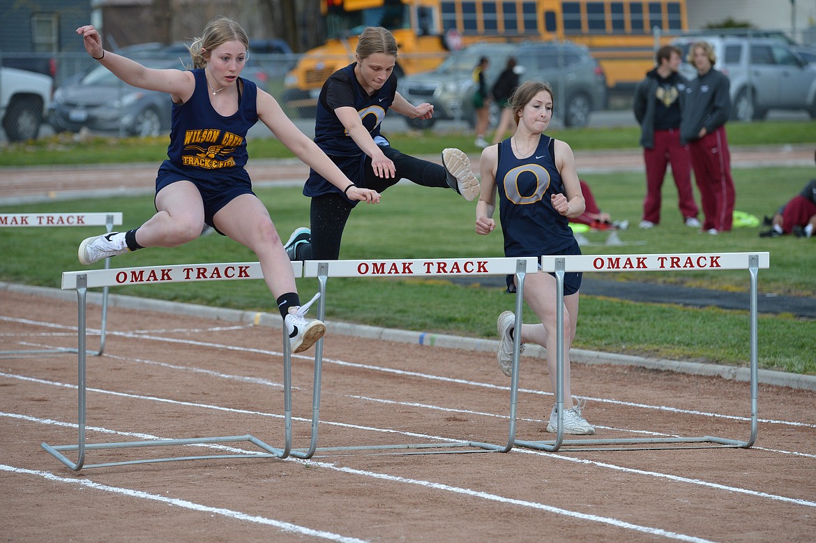 Hannah Smith (left) of Wilson Creek participates in the 100 meter hurdle event at the Omak Small Meet on April 19. Smith placed 4th in the event and was one of several Columbia Basin competitors to do well.