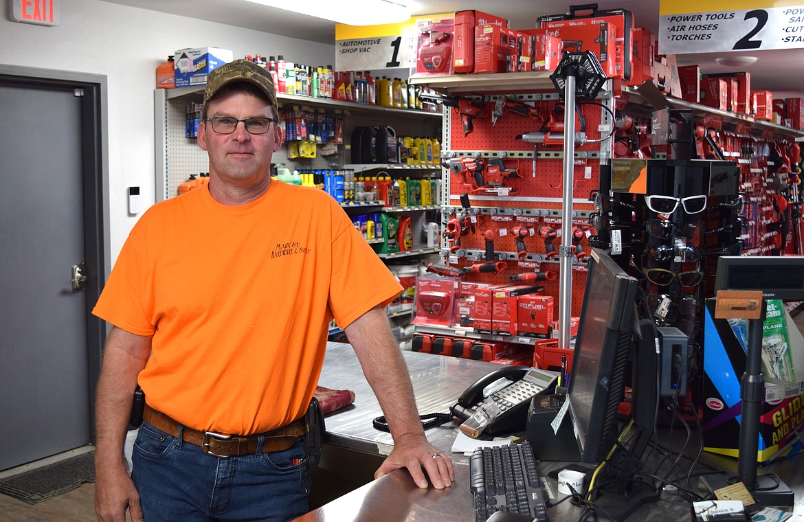 Chris Campbell, owner of Main St. Hardware & Supply, at the checkout desk of his business in downtown Warden.