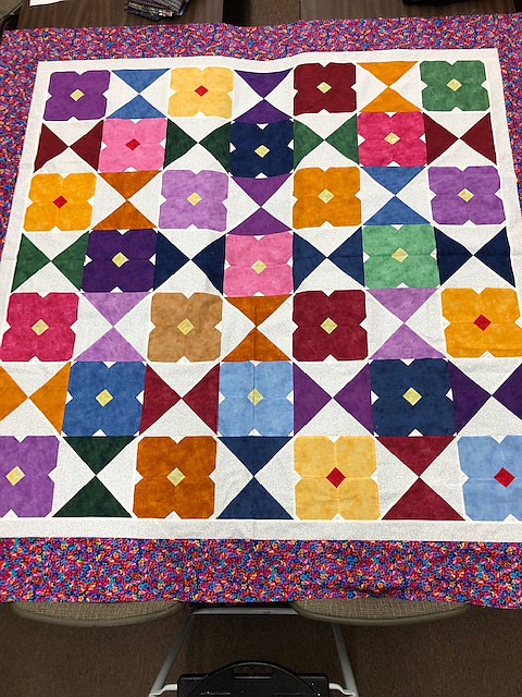 The Mountain Brook Ladies Club will be selling raffle tickets for the theira 75-inch by 75-inch “Flower Glass” quilt at the Mountain Brook Community Center and Library social May 7.