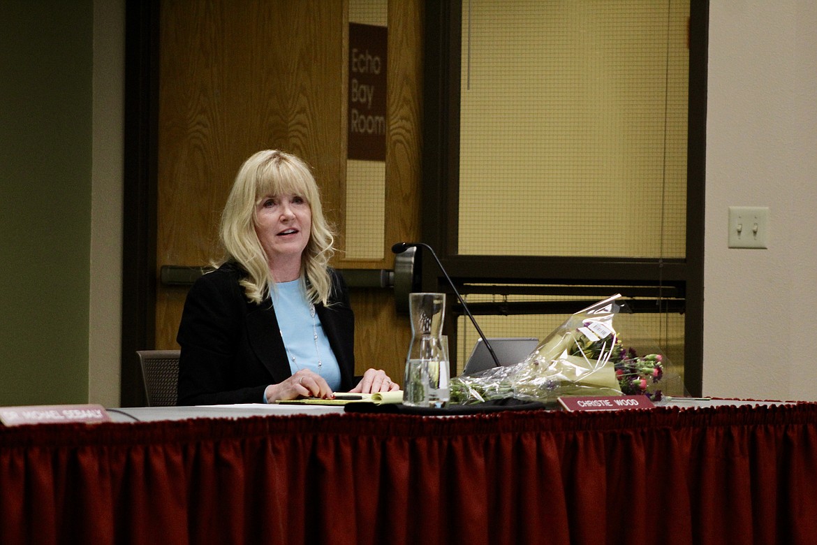 North Idaho College Trustee Christie Wood received flowers at the board meeting on Wednesday night, her last meeting as an NIC trustee before her resignation effective May 3rd. HANNAH NEFF/Press