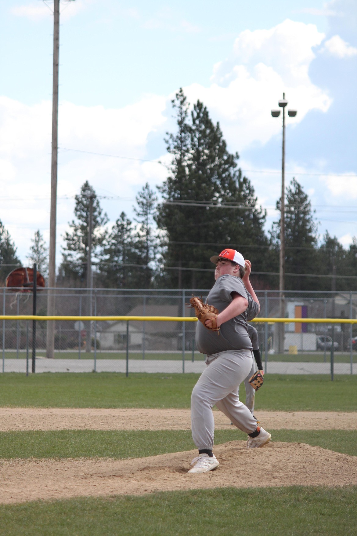 Courtesy photo
Brock Carpenter of the Post Falls Gray delivers a pitch against the Lakeland Pirates in Little League Juniors play on April 23.