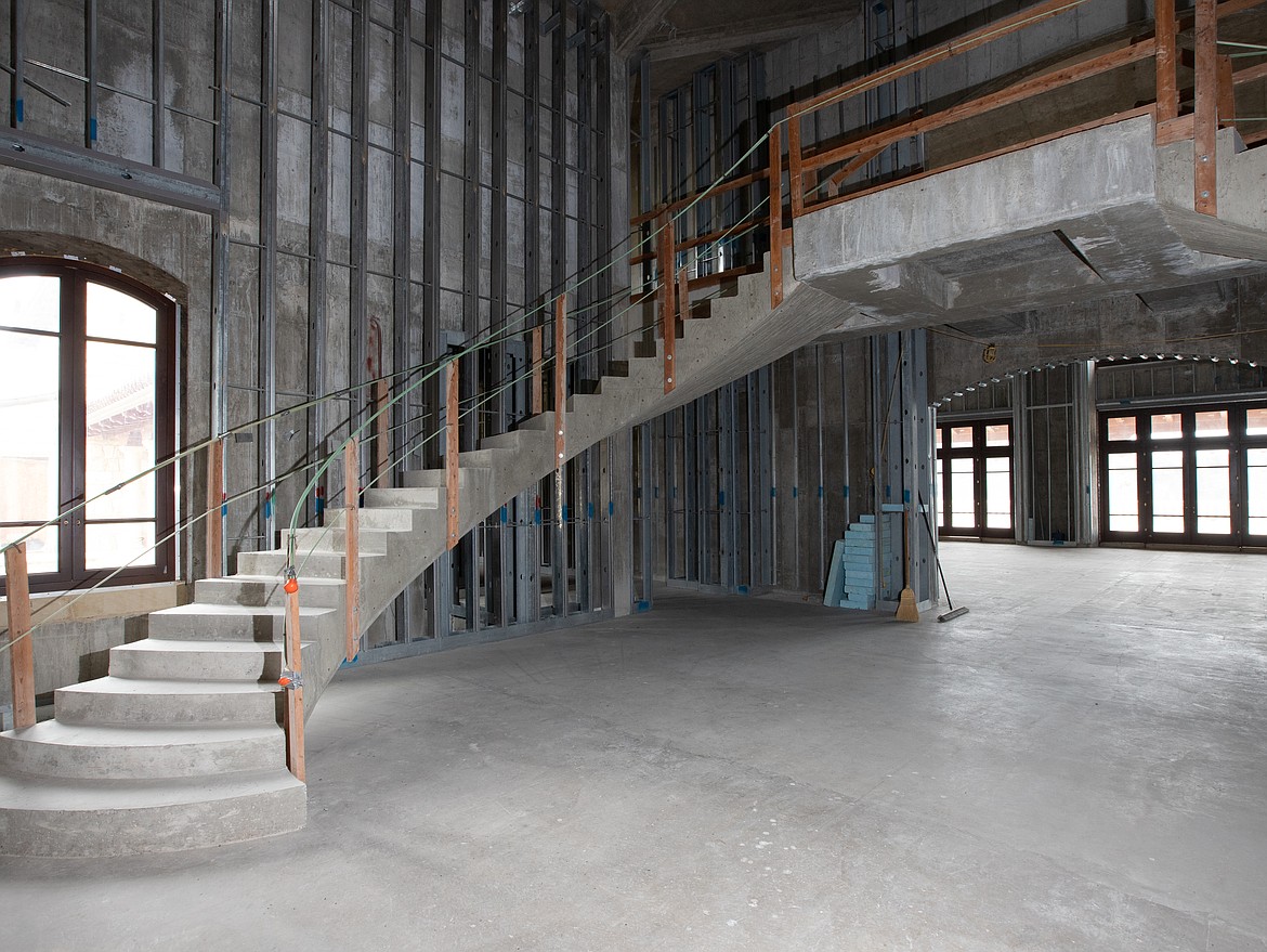 Cromwell Island in Flathead Lake is up for sale at $72 million. In the main house, the twin symmetrical and suspended staircases inside the main entrance are inspired by the
hanging staircase in the Nathaniel Russell House in Charleston, South Carolina. (Photo courtesy of Bill McDavid, Hall and Hall Partners)