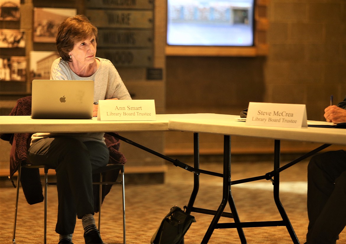 Coeur d'Alene Public Library Trustee Ann Smart listens to Trustee Steve McCrea during Wednesday's board meeting.