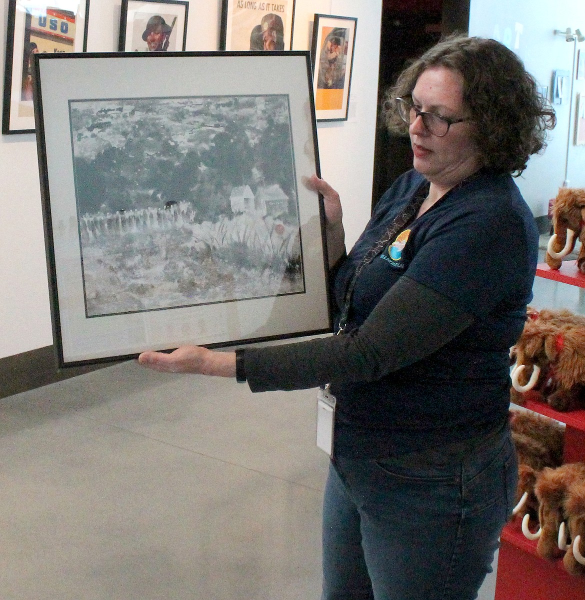 Moses Lake Museum & Art Center Director Dollie Boyd holds up “Revival,” by Moses Lake artist Judy Kalin. “Revival” will be part of “A Matter of Perspective” on display at the museum starting Friday.