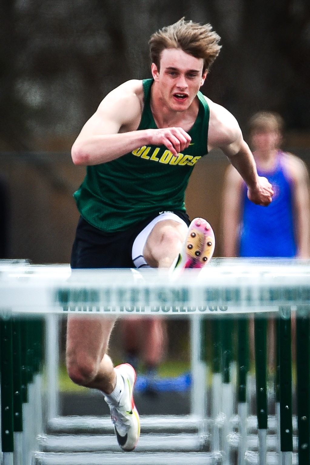 Whitefish's Bodie Smith clears a hurdle in the boys 110 meter hurdles at the Whitefish ARM Invitational on Saturday, April 30. (Casey Kreider/Daily Inter Lake)