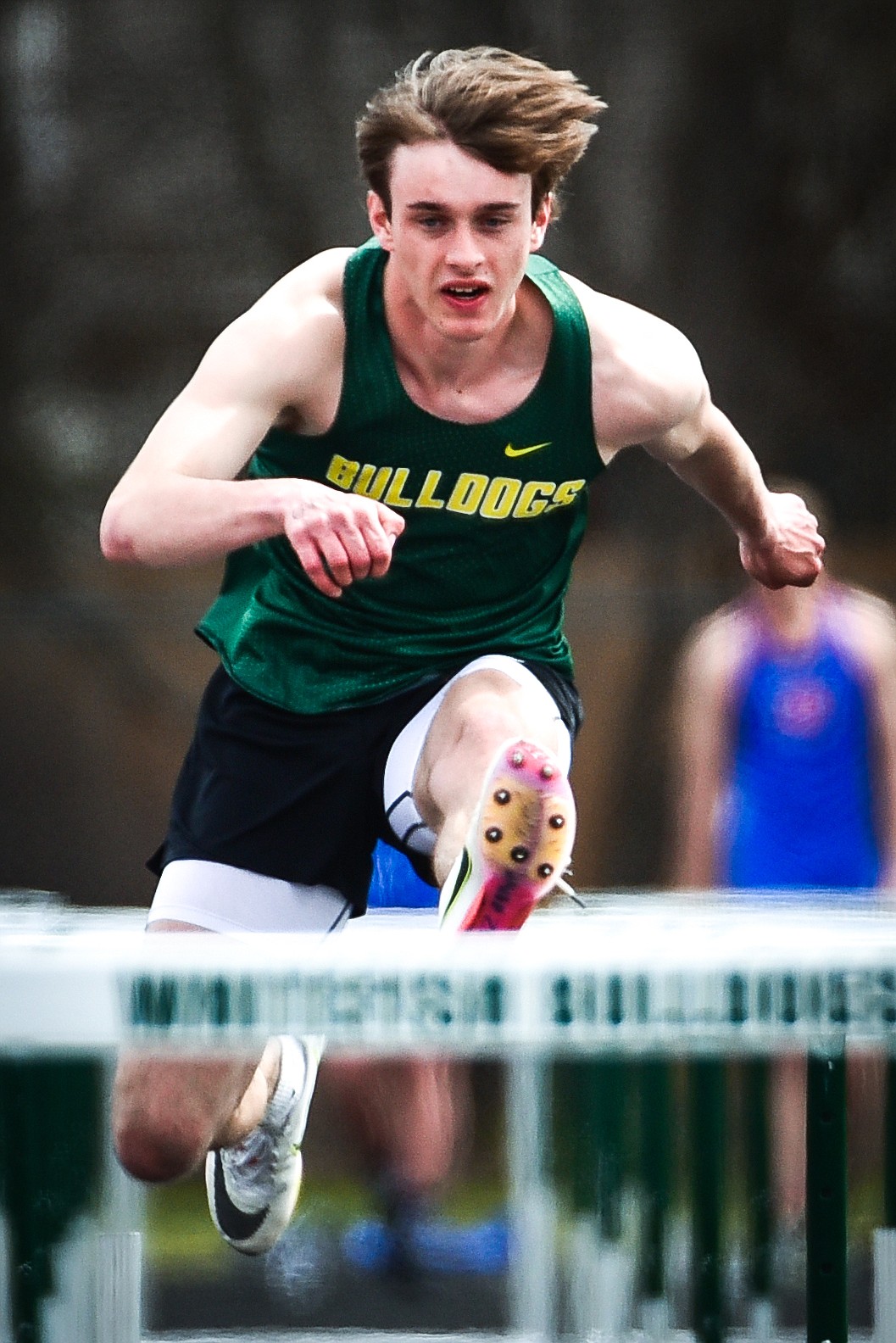 Whitefish's Bodie Smith clears a hurdle in the boys 110 meter hurdles at the Whitefish ARM Invitational on Saturday, April 30. (Casey Kreider/Daily Inter Lake)