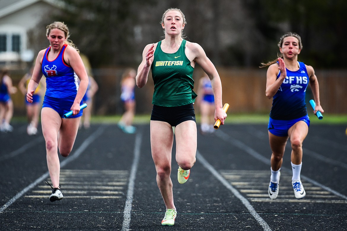 Whitefish' Brooke Zetooney heads to the finish line in the girls 4x100 meter relay at the Whitefish ARM Invitational on Saturday, April 30. Zetooney anchors the team with Rachael Wilmot, Erin Wilde and Hailey Ells. (Casey Kreider/Daily Inter Lake)